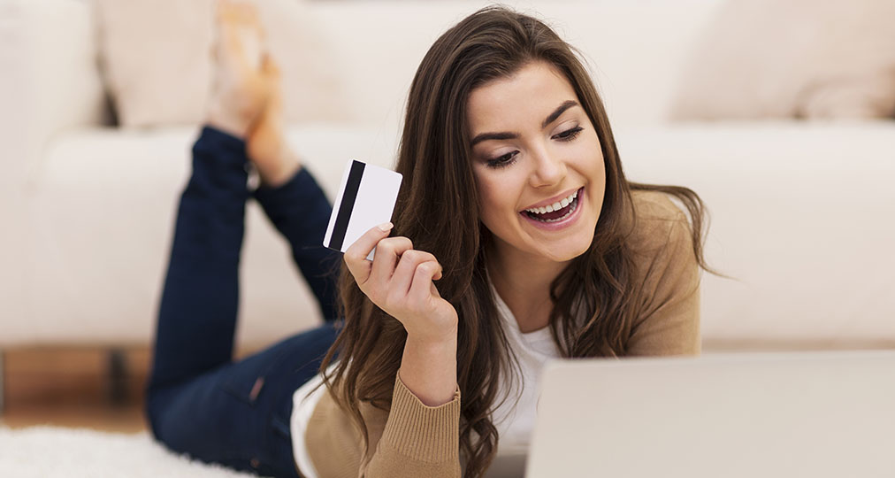 happy young woman shopping online