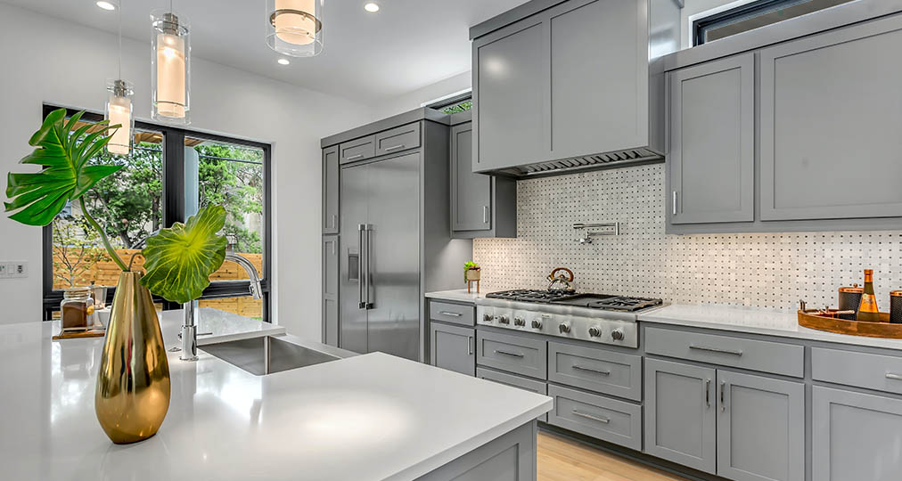 large kitchen with gray cabinets